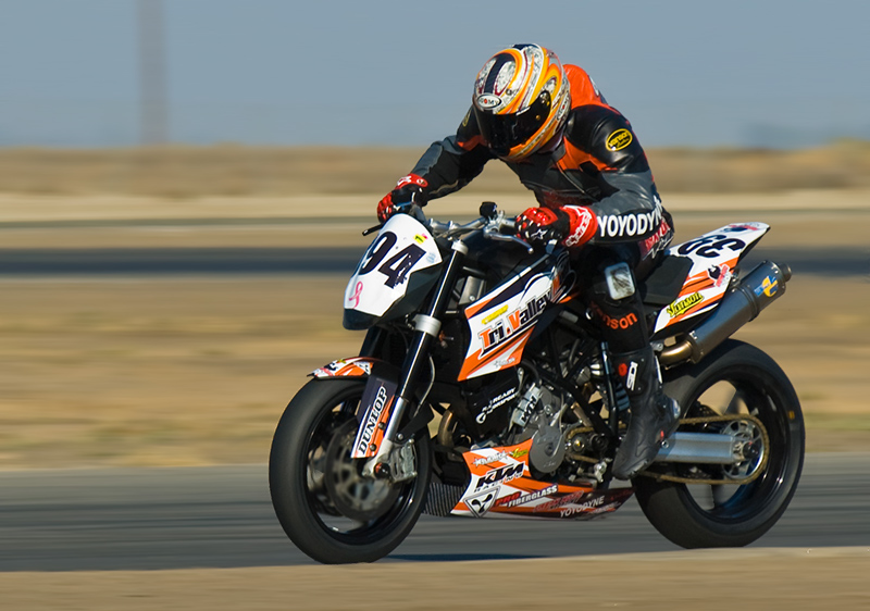 Eric GoGo Gulbransen at speed at Buttonwillow raceway on a KTM 990 Superduke