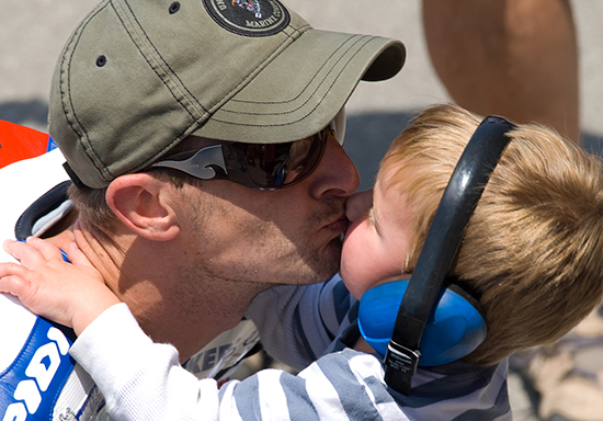 Colin Edwards kisses his son