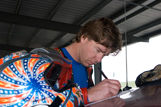 Eric GoGo Gulbransen writing notes fo rMotorcyclst Magazine